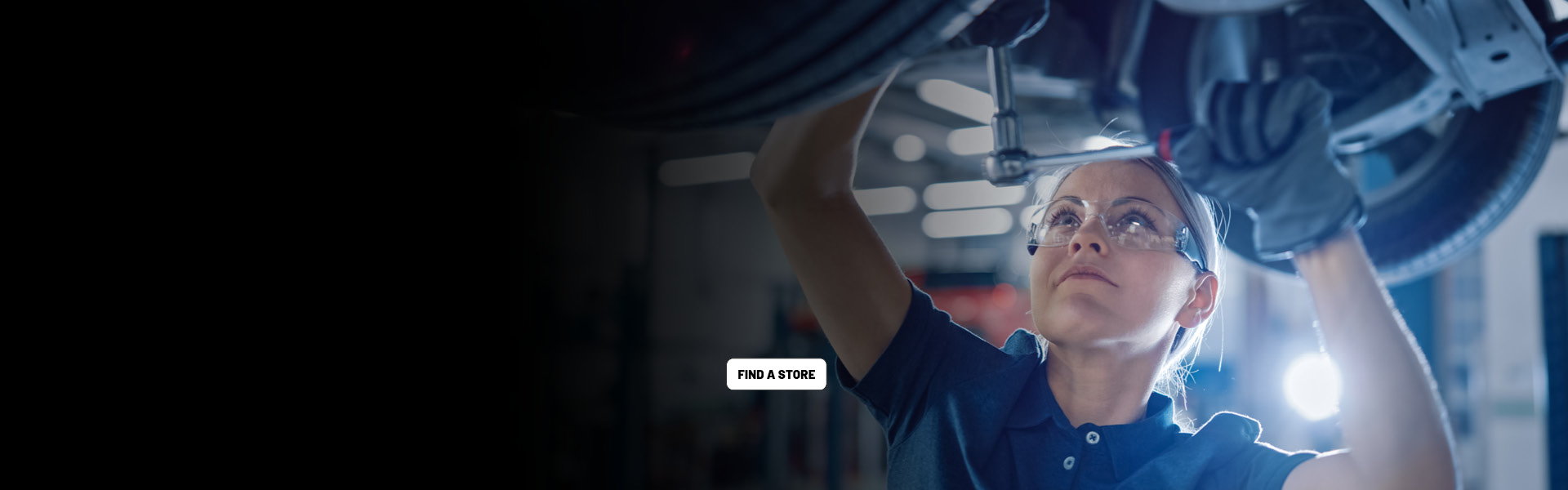 Woman mechanic working in auto bay